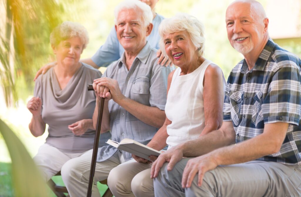 A group of older adults sitting together and enjoying the weather outside